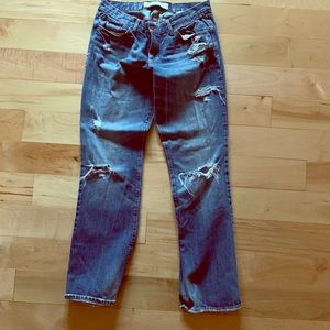 Straight legged torn jeans